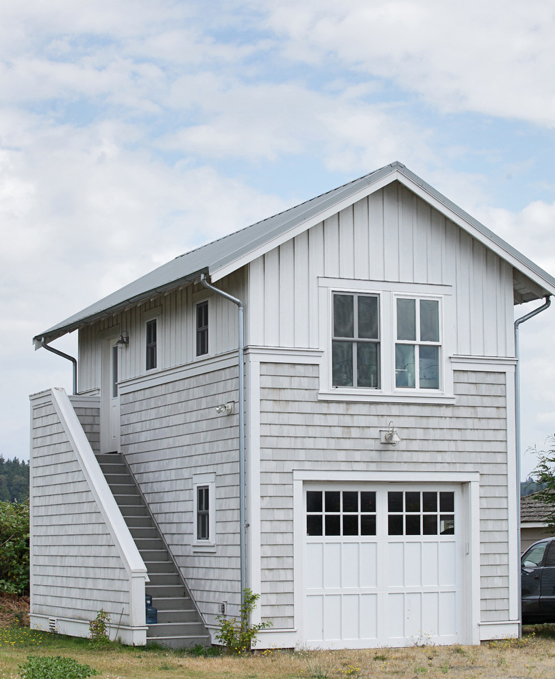 Photo of a small beach style detached one-car garage in Seattle.