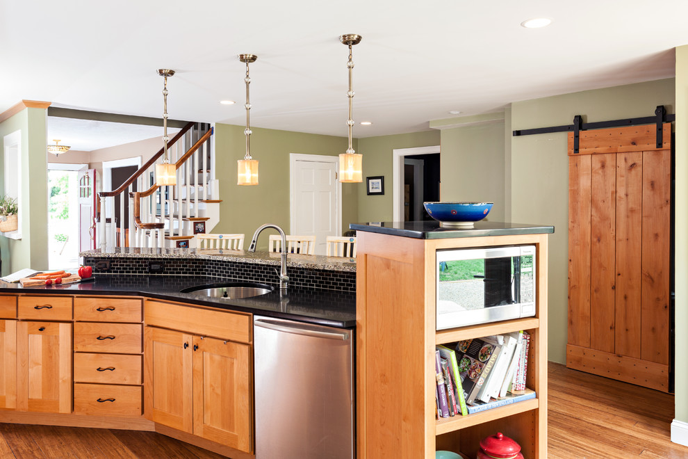 Inspiration for a mid-sized transitional u-shaped bamboo floor eat-in kitchen remodel in Boston with an undermount sink, shaker cabinets, medium tone wood cabinets, brown backsplash, stone tile backsplash, stainless steel appliances, green walls and an island