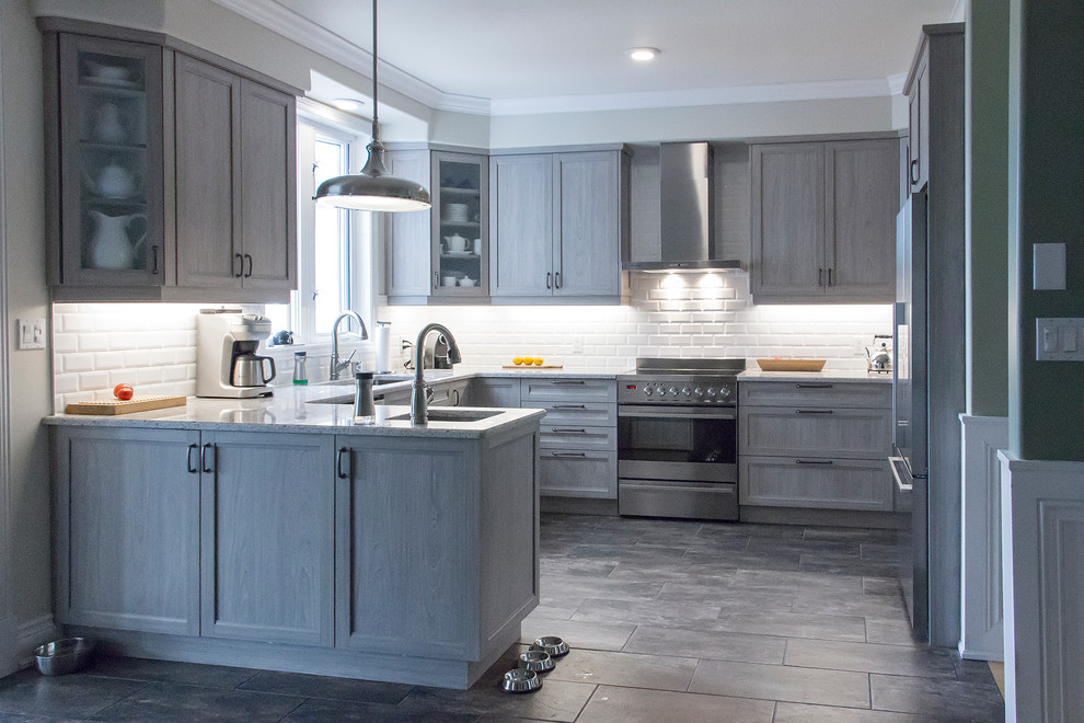 Mid-sized transitional u-shaped porcelain tile and beige floor open concept kitchen photo in Toronto with an undermount sink, shaker cabinets, light wood cabinets, quartz countertops, white backsplash, subway tile backsplash, stainless steel appliances and a peninsula