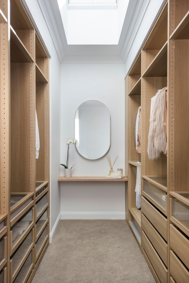 This is an example of a contemporary storage and wardrobe in Central Coast.