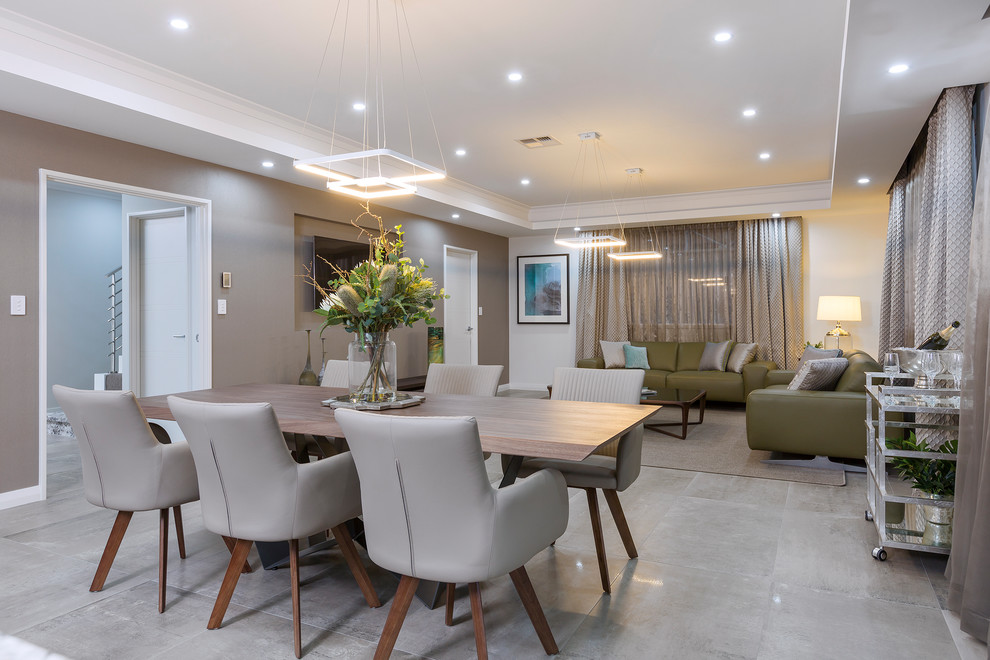 Design ideas for a contemporary dining room in Perth with beige walls, ceramic floors and beige floor.