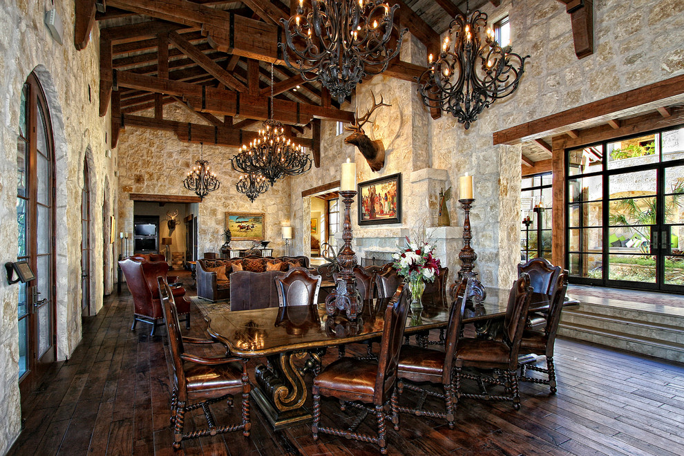 Mediterranean dining room in Austin with dark hardwood floors.