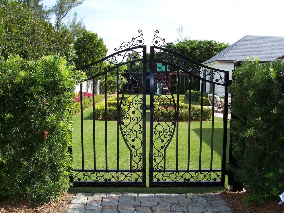 Design ideas for a transitional full sun backyard brick formal garden in Miami.