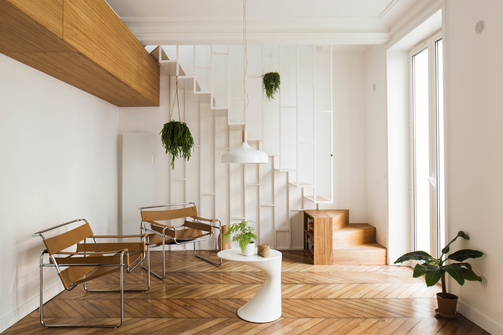 Inspiration for a mid-sized scandinavian wood straight staircase in Paris with open risers.