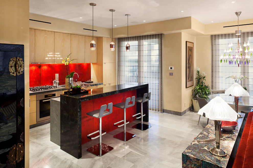 Photo of a contemporary galley eat-in kitchen in Los Angeles with stainless steel appliances, flat-panel cabinets, light wood cabinets, red splashback, with island, black benchtop, an undermount sink, porcelain floors, grey floor, granite benchtops and ceramic splashback.