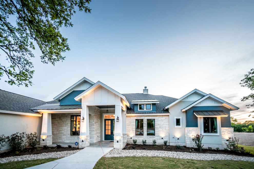 Example of a farmhouse exterior home design in Austin