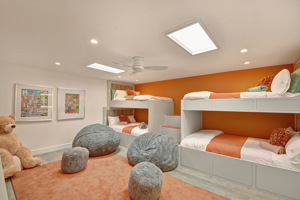 Contemporary gender-neutral kids' bedroom in Other with carpet and multi-coloured walls.