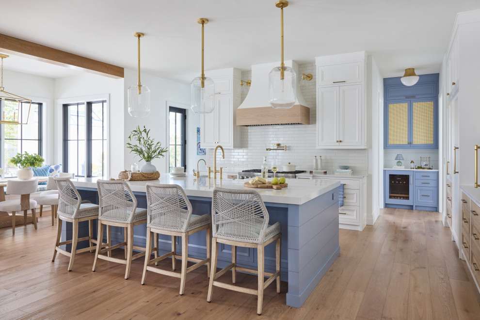 2 Chicks Happy Family Home - Two-Tone Coastal Kitchen with Blue Island and Brass Pendants. A custom two-tone kitchen with wood accents in a Ponte Vedra Beach new build by 2 Chicks Design Co. A mid-tone blue island with quartz counter, brass pendants and faucets, accent beam separating the eat-in dining area, and a dramatic hood anchor an open kitchen, dining and family area designed for entertaining.
Tags: Transitional Kitchen, Coastal Kitchen, Blue Kitchen Island, Two-Tone Kitchen, Brass Pendant, Open Kitchen, Beam Ceiling