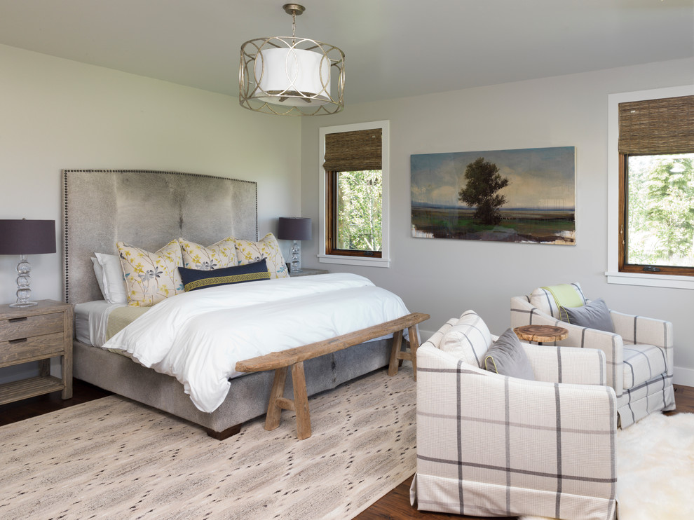 Mid-sized country master bedroom in Other with beige walls, medium hardwood floors and no fireplace.