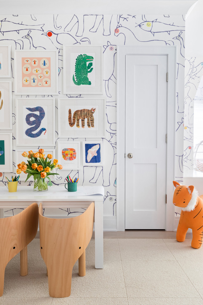 Design ideas for a mid-sized traditional gender-neutral kids' playroom for kids 4-10 years old in New York with multi-coloured walls, light hardwood floors and brown floor.