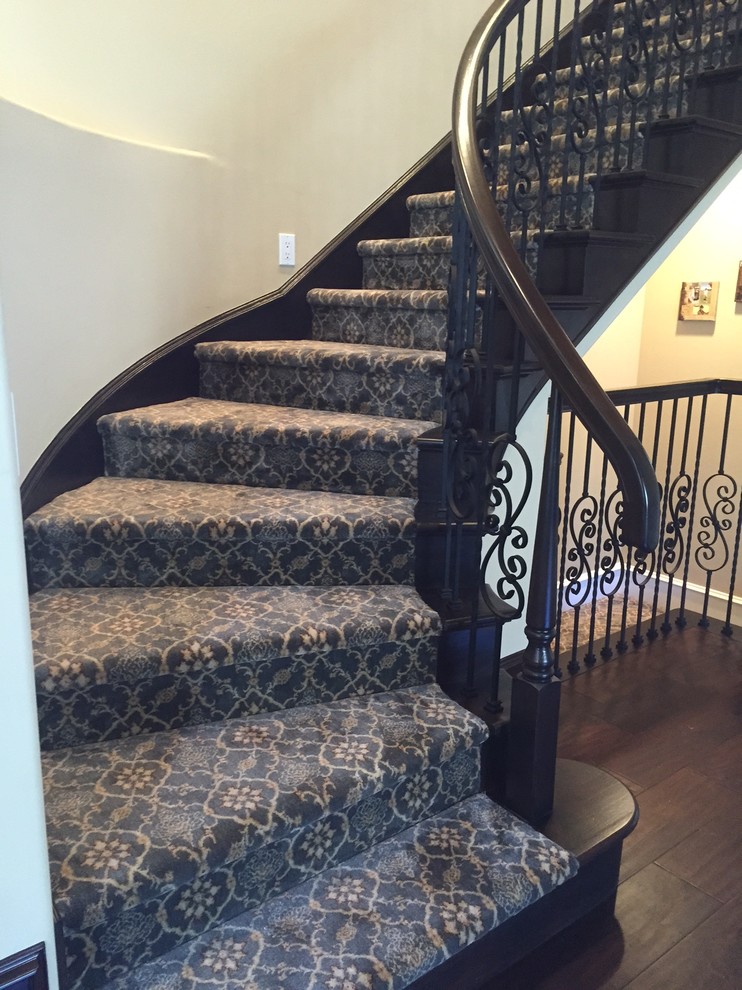Inspiration for a large traditional painted wood spiral staircase in Phoenix with carpet risers and mixed railing.