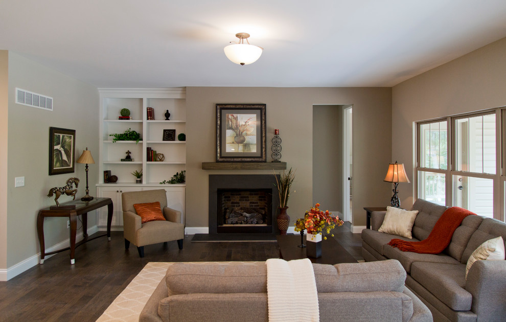 Large transitional formal and open concept dark wood floor and brown floor living room photo in St Louis with beige walls, a standard fireplace and a stone fireplace