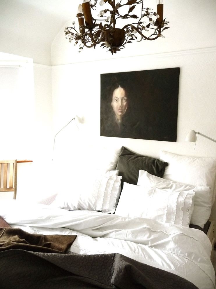 This is an example of an eclectic bedroom in Other with white walls.