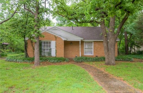 Little brick box with a side facing front door Little brick box with a side facing front door