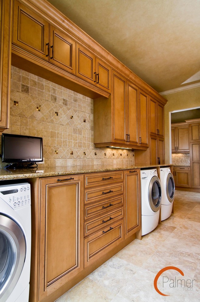 This is an example of a traditional laundry room in Austin.
