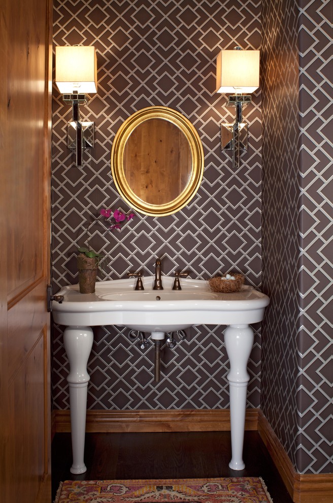 Inspiration for a small eclectic powder room in Denver with grey walls, dark hardwood floors and a pedestal sink.