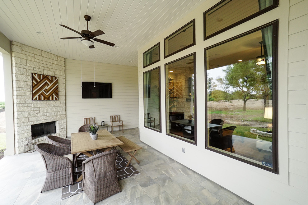 This is an example of a cottage porch design in Austin.