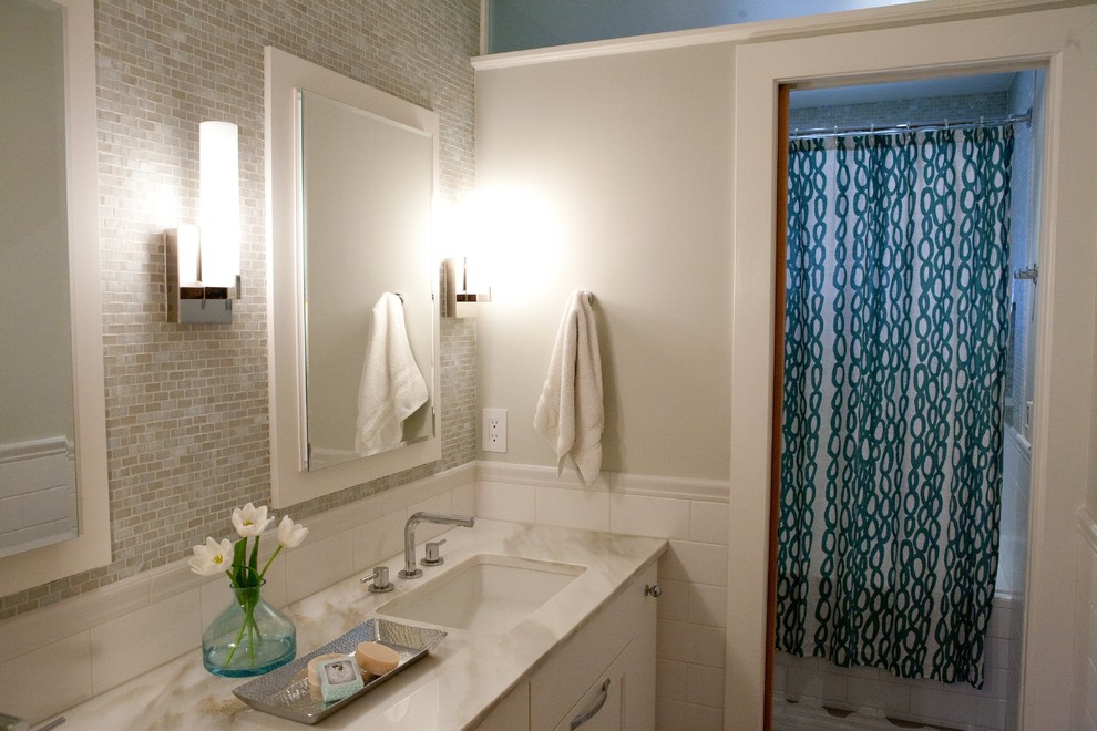 Mid-sized transitional gray tile and mosaic tile bathroom photo in Denver with white cabinets, an undermount sink and marble countertops