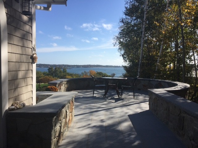 Inspiration for a mid-sized timeless backyard concrete paver patio remodel in Boston with no cover