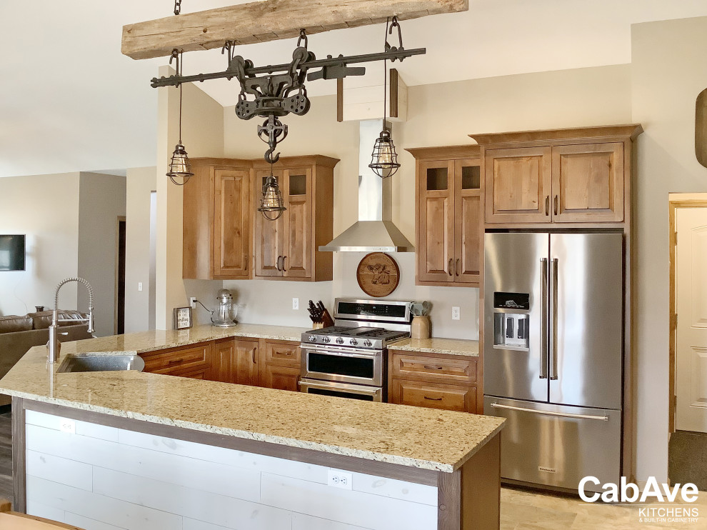 Example of a mid-sized mountain style u-shaped ceramic tile and beige floor open concept kitchen design in New York with a farmhouse sink, raised-panel cabinets, brown cabinets, quartz countertops, stainless steel appliances, a peninsula and brown countertops