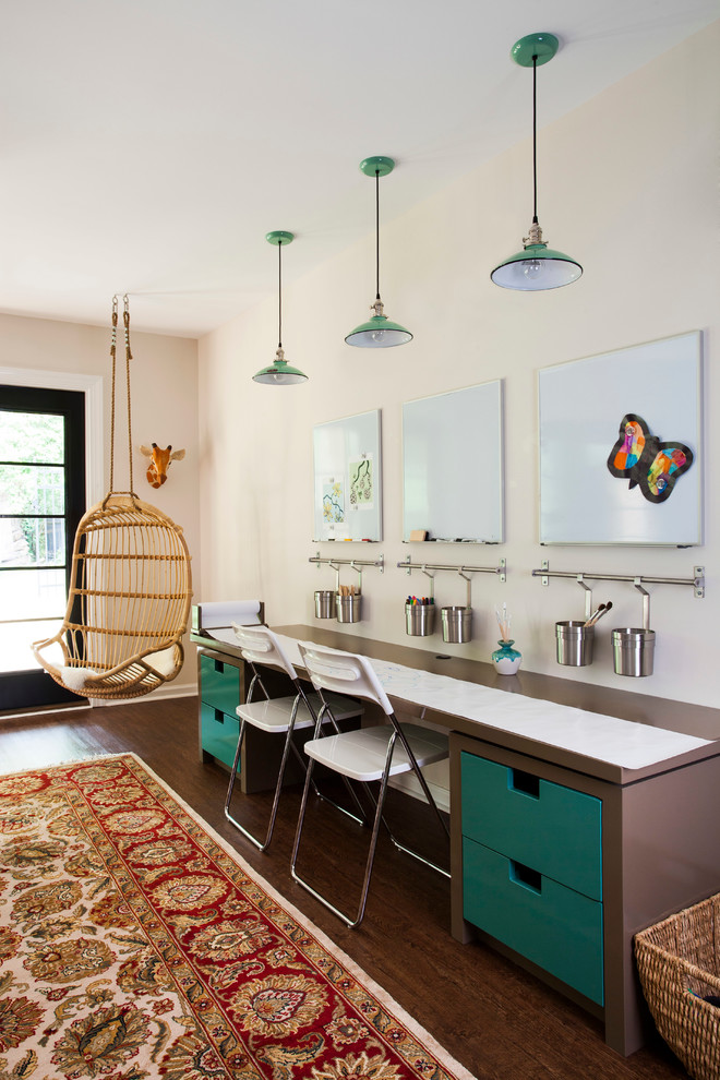 This is an example of a mid-sized transitional gender-neutral kids' study room for kids 4-10 years old in Atlanta with white walls and dark hardwood floors.