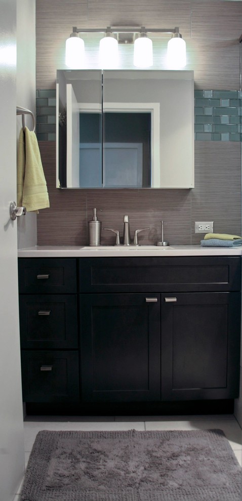 Photo of a small contemporary master bathroom in San Francisco with recessed-panel cabinets and black cabinets.