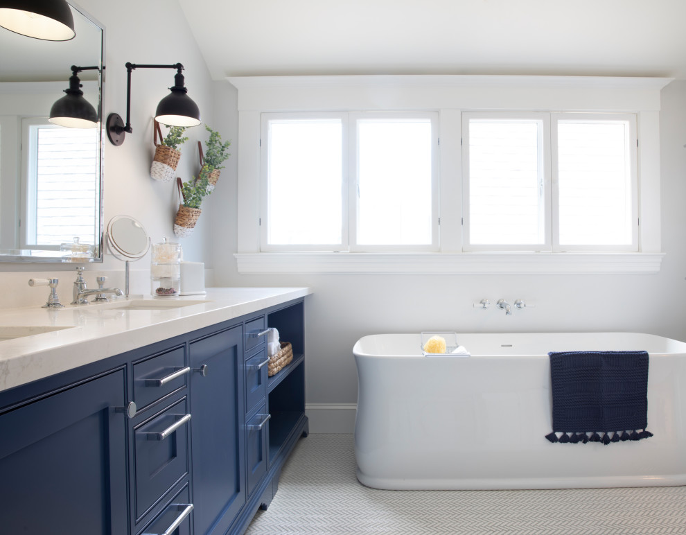 Master bathroom in San Francisco with a sliding shower screen, white benchtops and a double vanity.