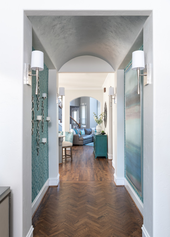 Mid-sized transitional medium tone wood floor, brown floor and wallpaper foyer photo in Dallas with gray walls and a medium wood front door