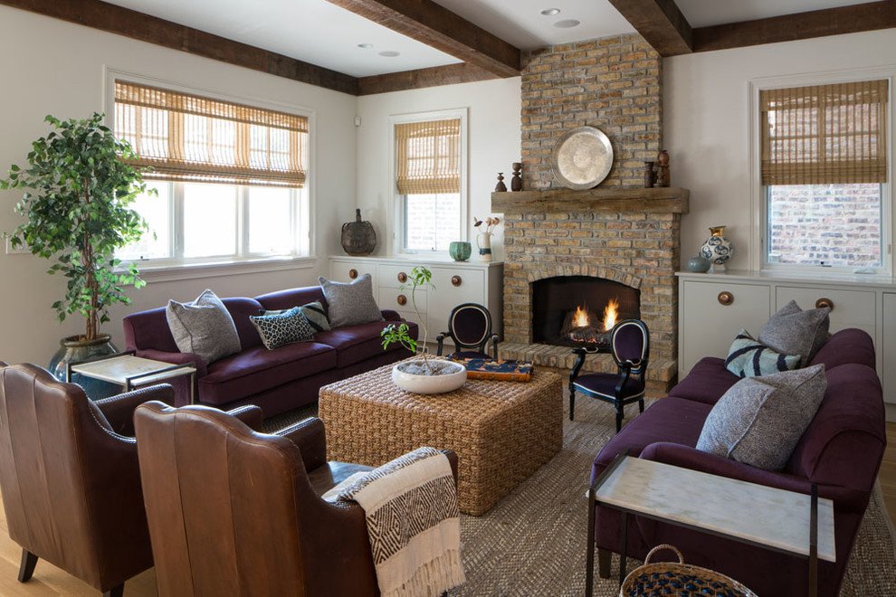 Photo of a large transitional open concept family room in Chicago with white walls, medium hardwood floors, a standard fireplace, a brick fireplace surround and brown floor.