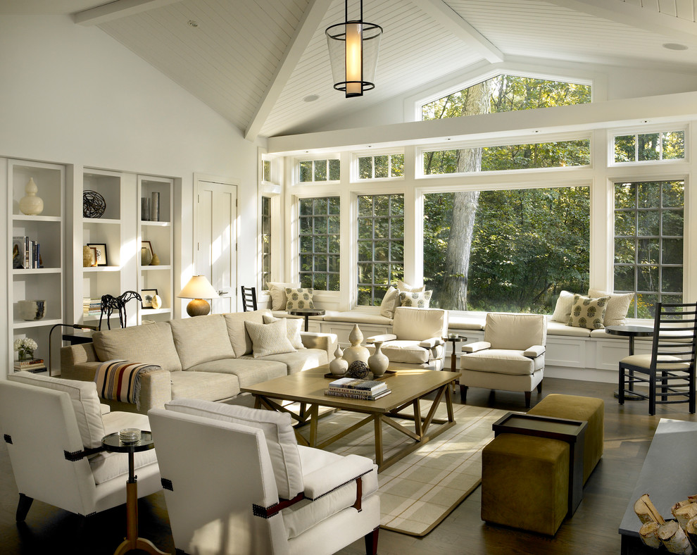 Inspiration for a transitional family room in Chicago with white walls, brown floor and dark hardwood floors.