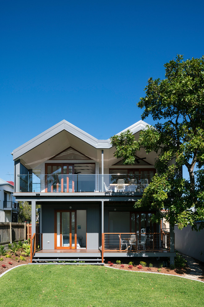 Design ideas for a modern two-storey grey exterior in Brisbane with a gable roof.