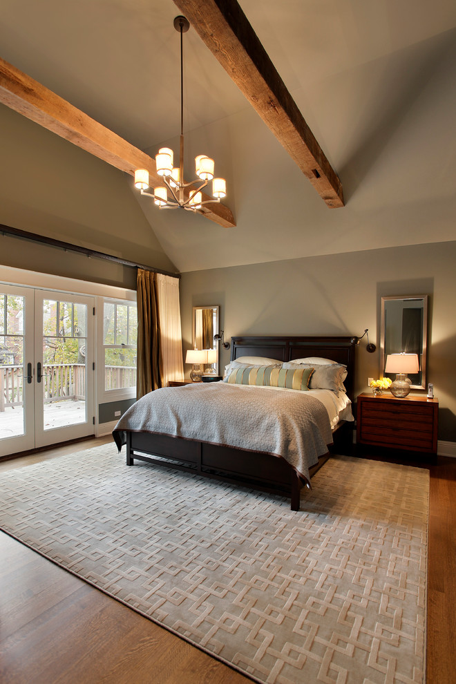 Design ideas for an arts and crafts master bedroom in Chicago with dark hardwood floors.