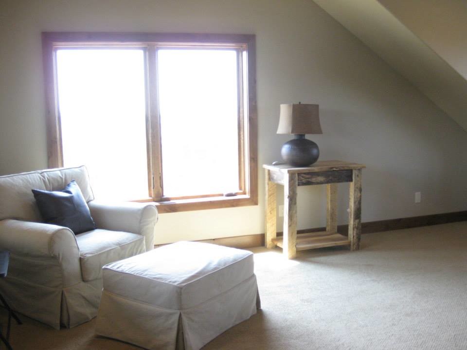 Inspiration for a mid-sized rustic guest carpeted bedroom remodel with beige walls