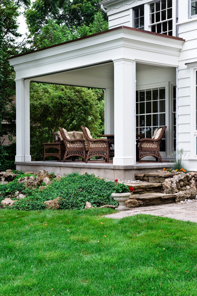 This is an example of a traditional verandah in Toronto with a roof extension.