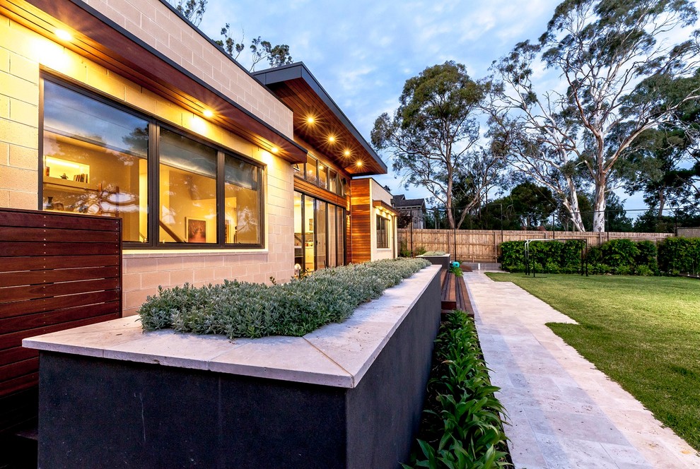Large contemporary two-storey grey exterior in Melbourne with wood siding and a gable roof.