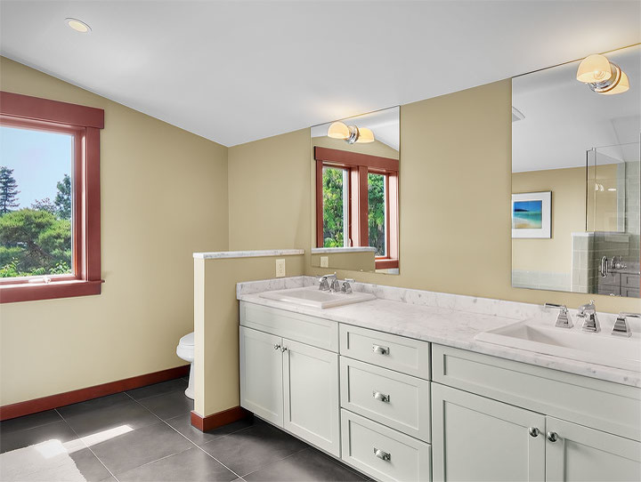 Design ideas for a mid-sized arts and crafts master bathroom in Seattle with shaker cabinets, green cabinets, a drop-in tub, an alcove shower, gray tile, subway tile, yellow walls, a drop-in sink, marble benchtops, grey floor, a hinged shower door and grey benchtops.