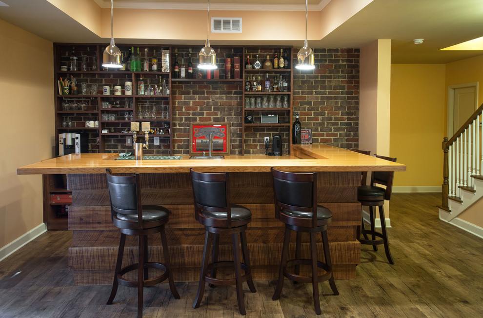 Inspiration for a mid-sized arts and crafts u-shaped seated home bar in Atlanta with medium wood cabinets, wood benchtops, brown splashback and dark hardwood floors.