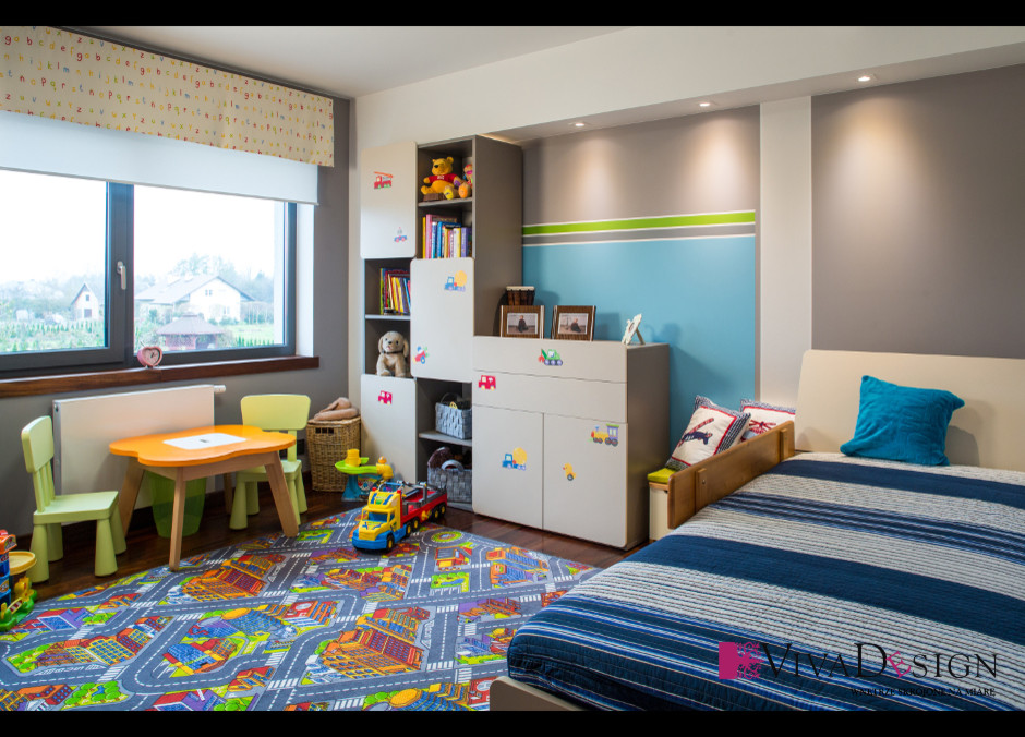 Mid-sized modern kids' bedroom in Other with beige walls and dark hardwood floors for kids 4-10 years old and boys.