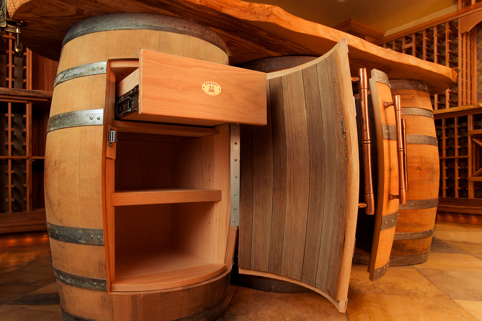 Inspiration for a mid-sized country wine cellar in Seattle with travertine floors and storage racks.
