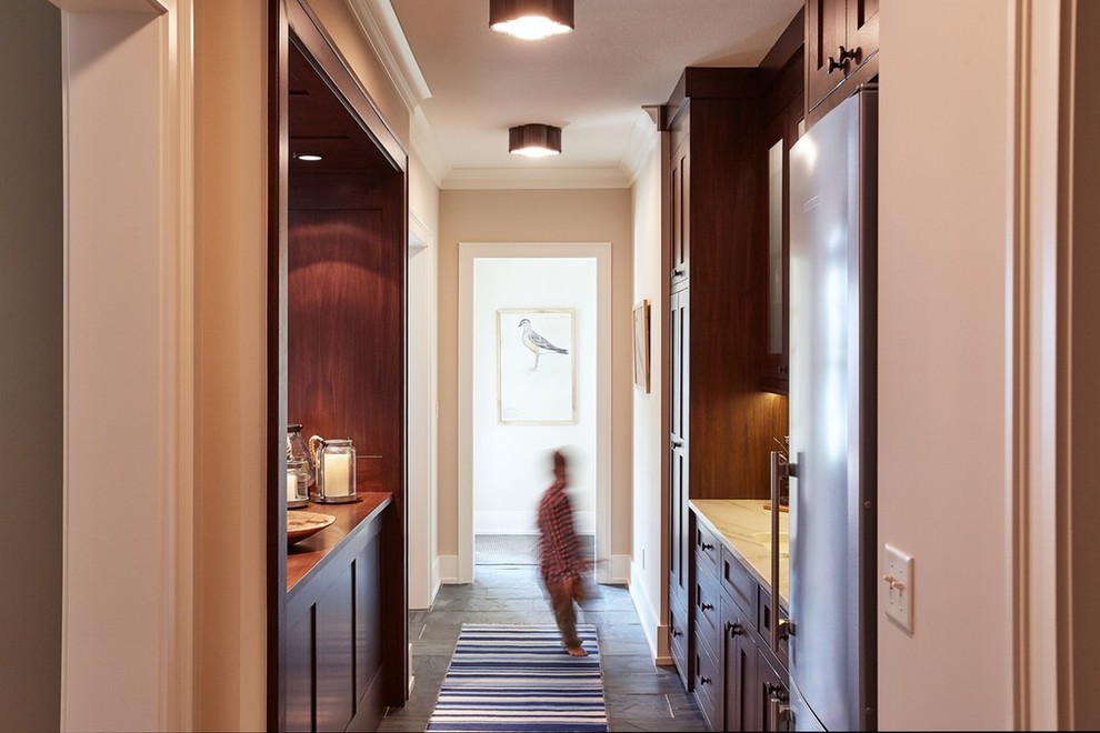 Mid-sized transitional underground slate floor basement photo in Minneapolis with beige walls and no fireplace