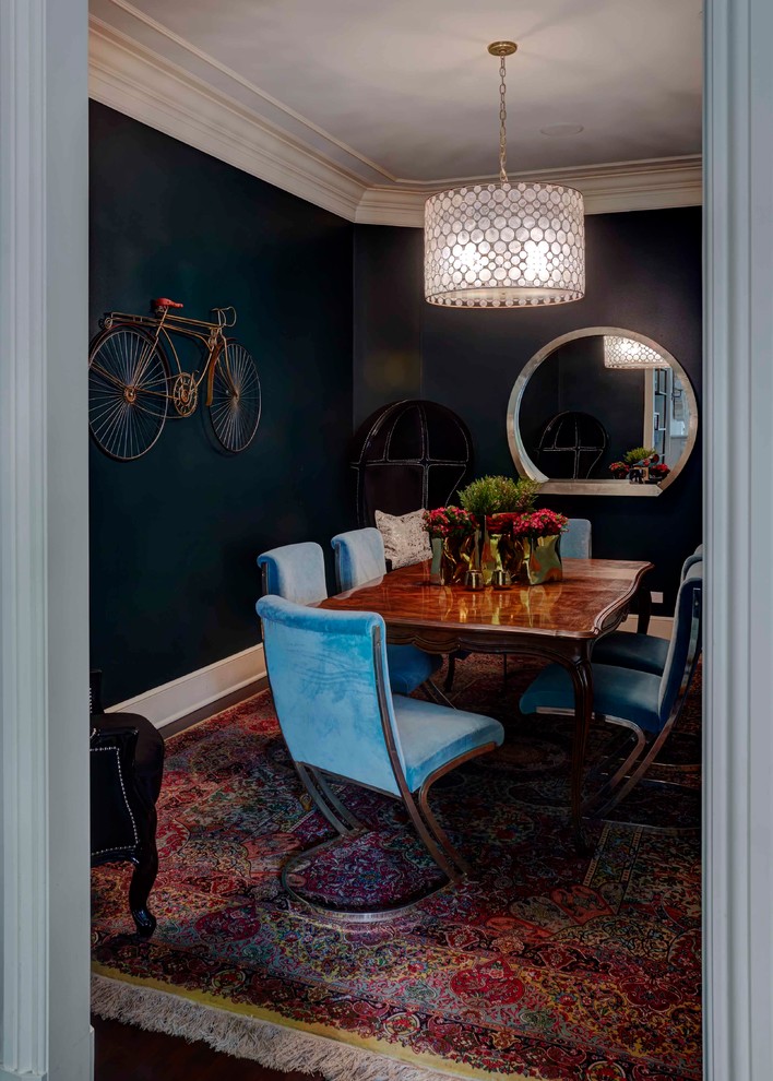 Photo of a mid-sized eclectic separate dining room in Chicago with dark hardwood floors, no fireplace and green walls.