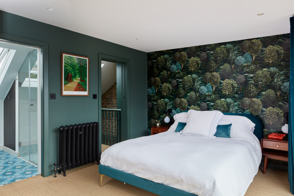 Inspiration for a mid-sized eclectic master bedroom in London with green walls, carpet, beige floor and wallpaper.