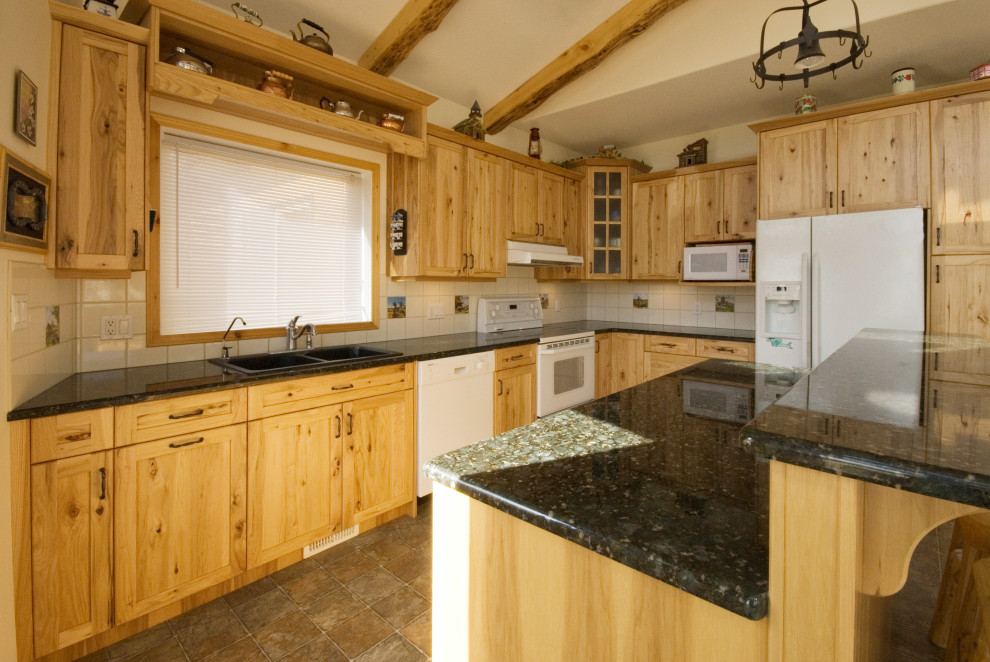 Example of a mountain style kitchen design in Calgary