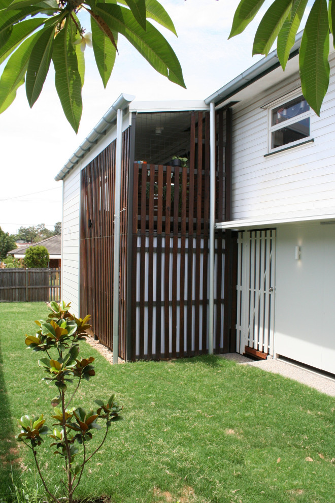 Mid-sized modern two-storey exterior in Brisbane with wood siding.