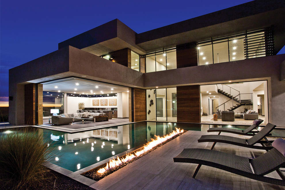 Design ideas for an expansive contemporary backyard custom-shaped infinity pool in Las Vegas.