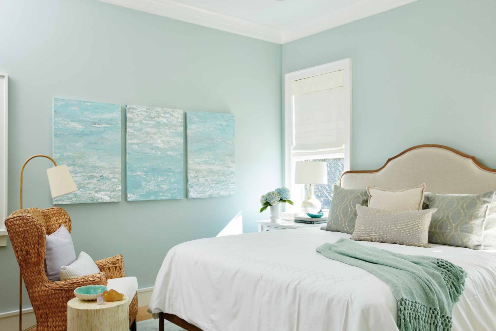 Inspiration for a mid-sized beach style master bedroom in New York with medium hardwood floors and no fireplace.