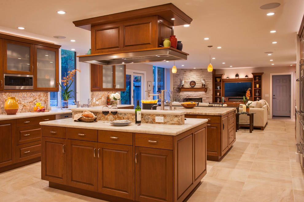 Design ideas for a large transitional u-shaped open plan kitchen in San Francisco with raised-panel cabinets, medium wood cabinets and multiple islands.