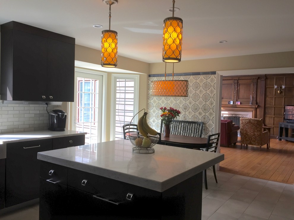 Mid-sized transitional u-shaped ceramic tile and beige floor kitchen photo in Chicago with a farmhouse sink, flat-panel cabinets, medium tone wood cabinets, solid surface countertops, white backsplash, ceramic backsplash, stainless steel appliances and an island
