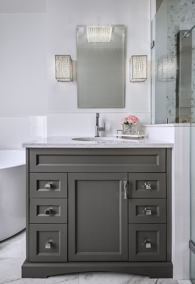 Inspiration for a small transitional master white tile and porcelain tile porcelain tile and white floor open shower remodel in Toronto with gray cabinets, a one-piece toilet, white walls, an undermount sink, quartz countertops and shaker cabinets