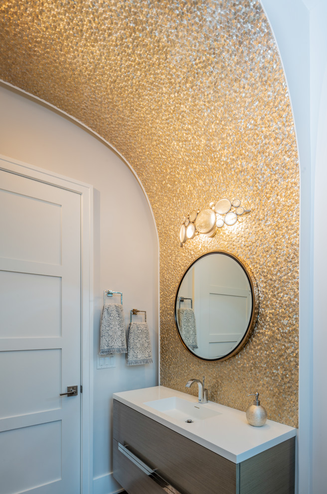 Powder room - mid-sized modern powder room idea in Columbus with flat-panel cabinets, quartzite countertops and white countertops